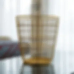 Elegant gold wire trash can showcasing intricate design details