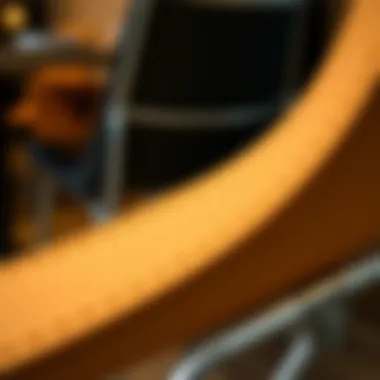 Close-up of the ergonomic design of a folding pub height chair.