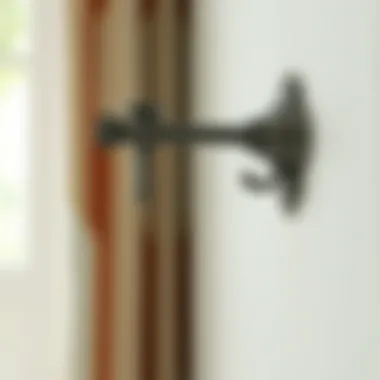 Pewter Bracket in Context Close-up of a pewter bracket installed on a wall with curtains.