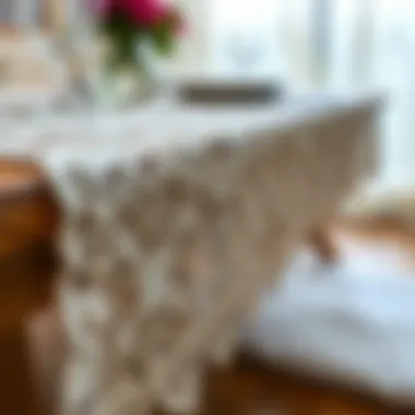 Close-up of intricate lace detailing on a sheer table runner