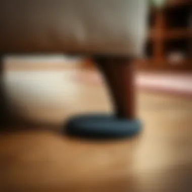 Close-up of sofa leg pad protecting flooring