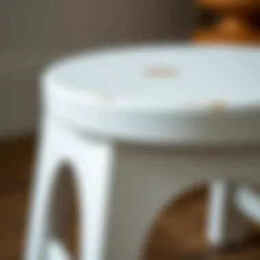 Close-up of the craftsmanship and finish of a white wooden stool