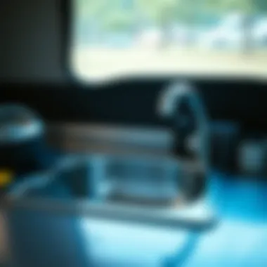 Well-maintained stainless steel camping sink with accessories