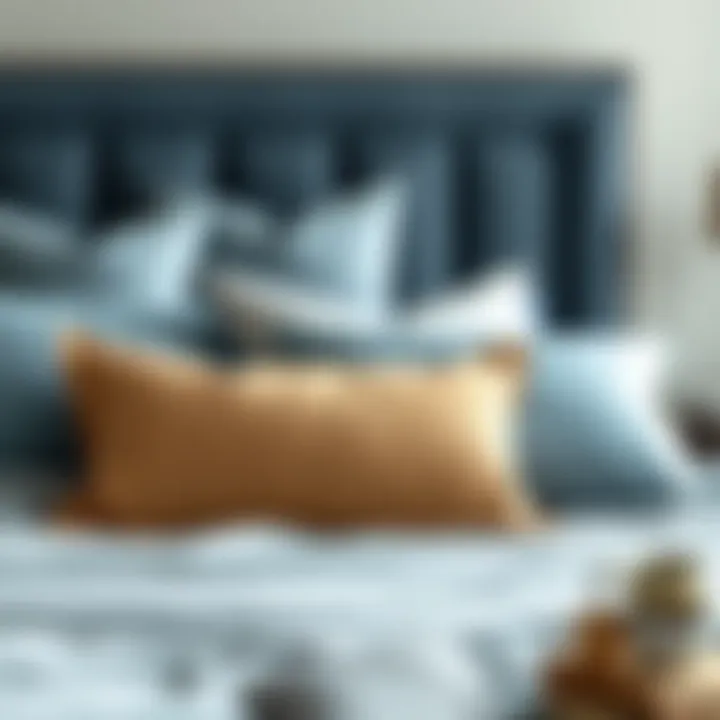 Artful Arrangement of Pillows with Soft Blue Duvet Stylish arrangement of pillows on a bed with soft blue duvet